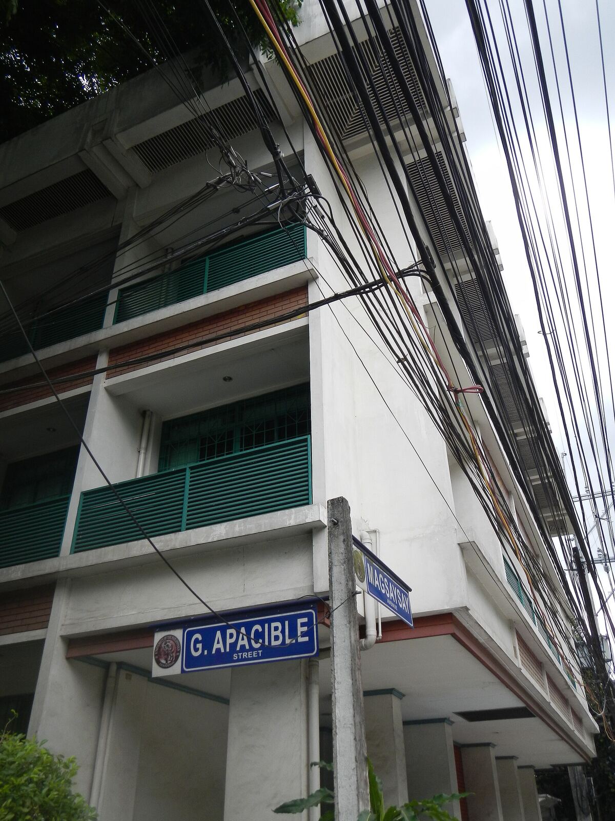 G. Apacible Street | Life of Internet A street sign for G. Apacible Street in the Philippines, showing an urban landscape.