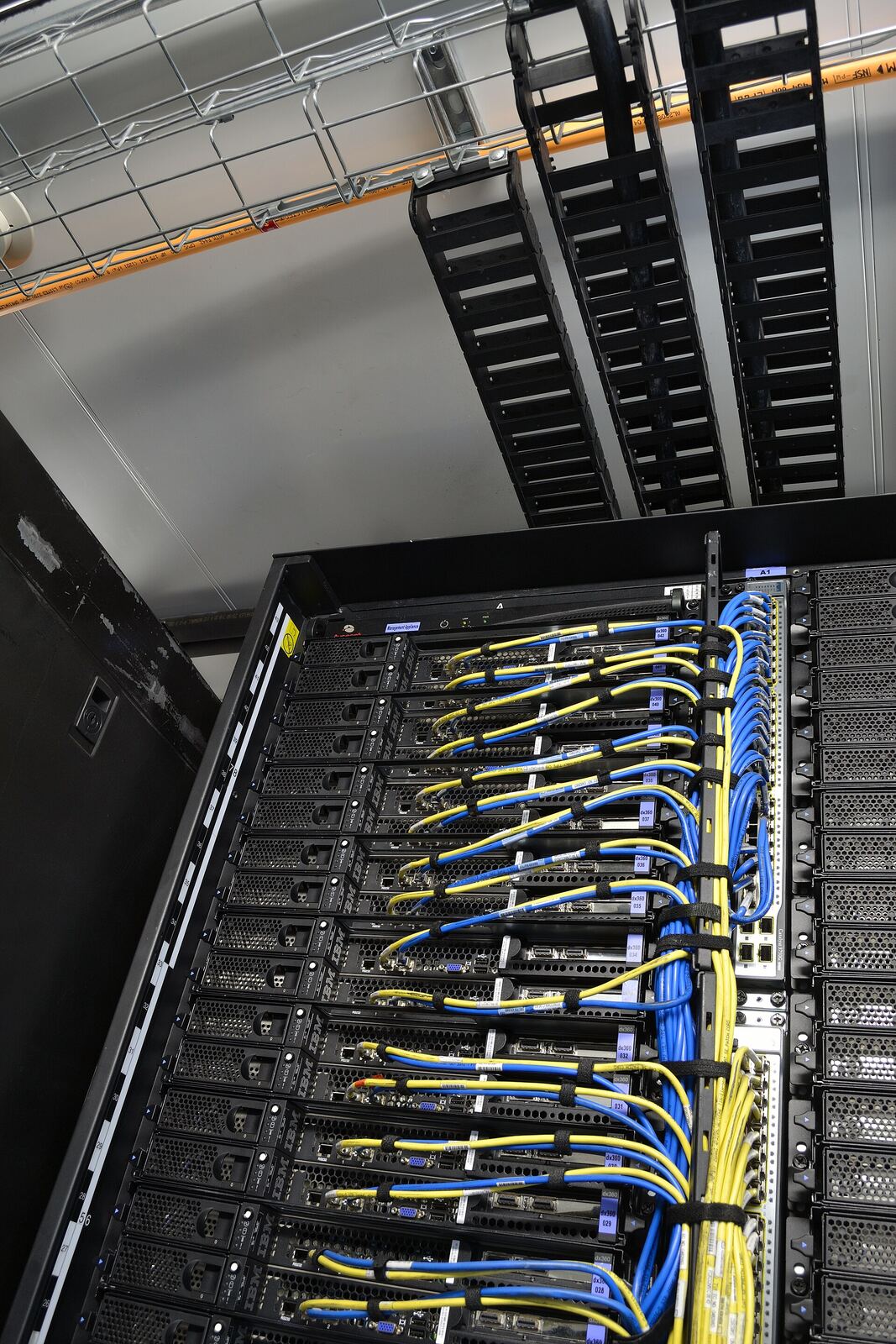IBM Portable Data Center | Life of Internet A server rack filled with network equipment and colorful cabling is shown, illustrating the scale of it infrastructure.