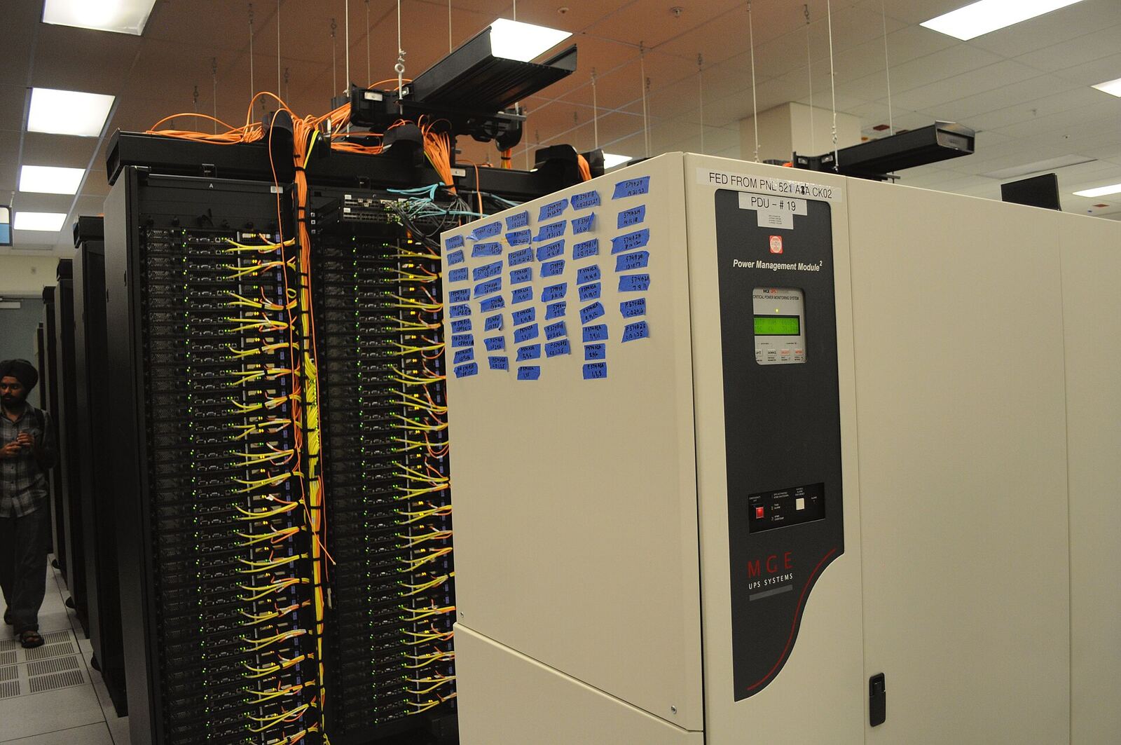 Server Rack | Life of Internet A server room with network cables and power distribution units shows IT infrastructure.