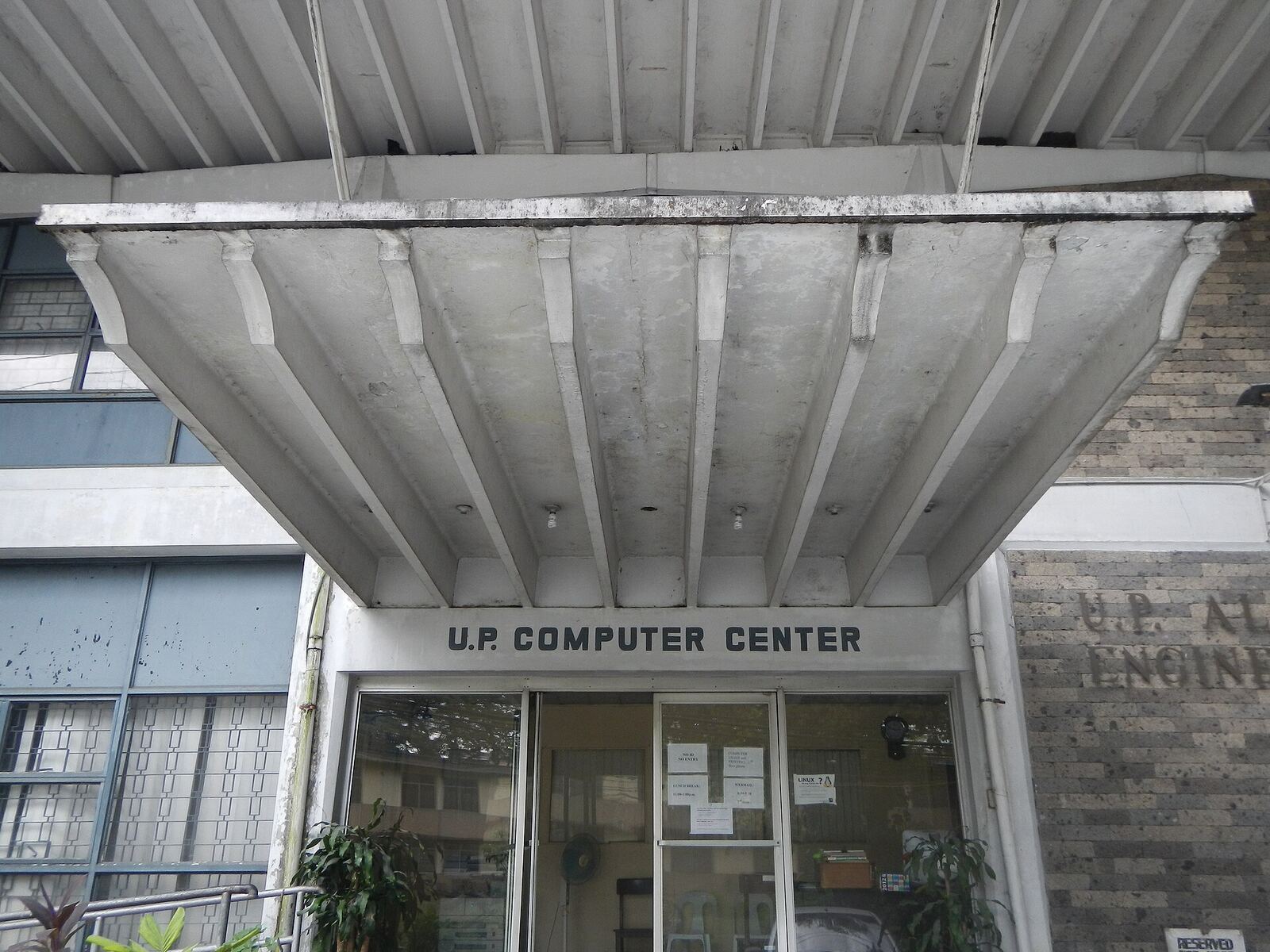 University of the Philippines | Life of Internet The University of the Philippines Computer Center building shows a textured concrete overhang, an example of network.