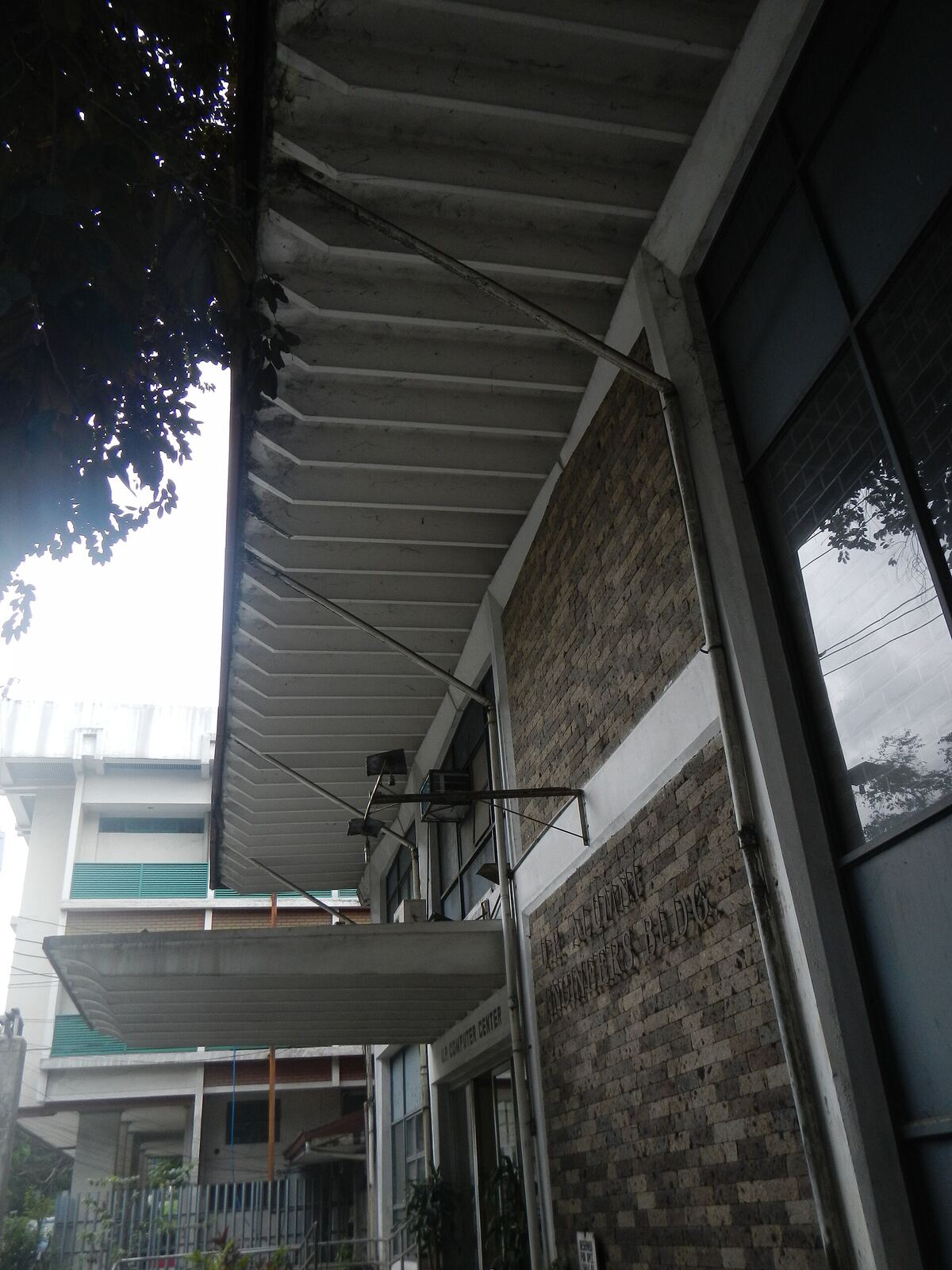 University of the Philippines | Life of Internet A building exterior of the University of the Philippines Computer Center, showcasing its architecture and place in internet.